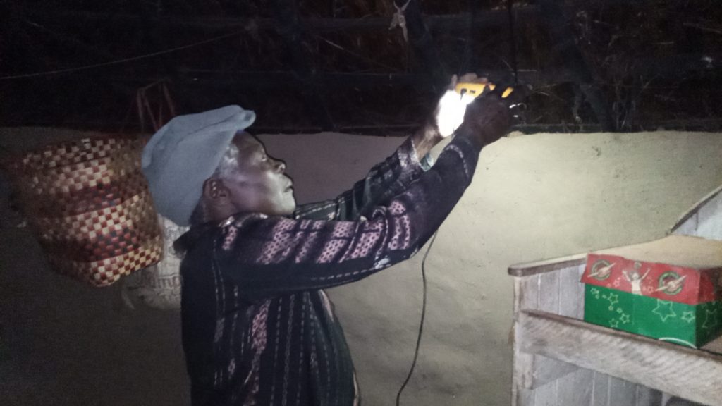 Mrs. Margret Okot, is a subsistence farmer but saved to buy solar power since she was asthmatic and could not bear the sort emitting kerosene lamps anymore